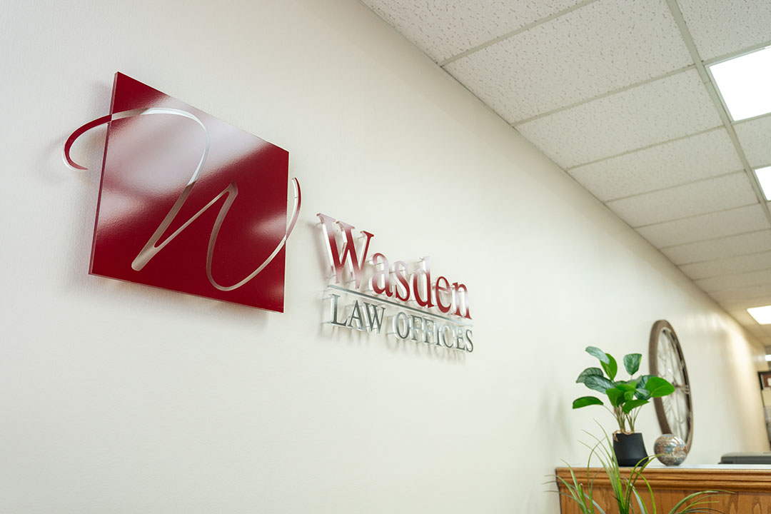 Interior of Wasden Law Offices with their logo on the wall